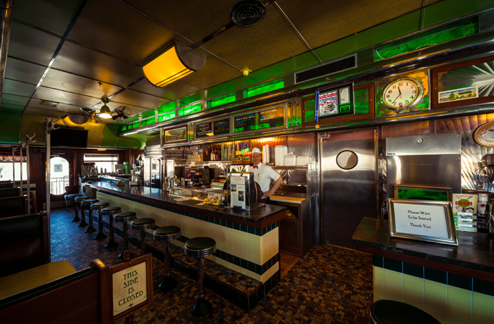 The interior of the diner standing at the entrance looking in